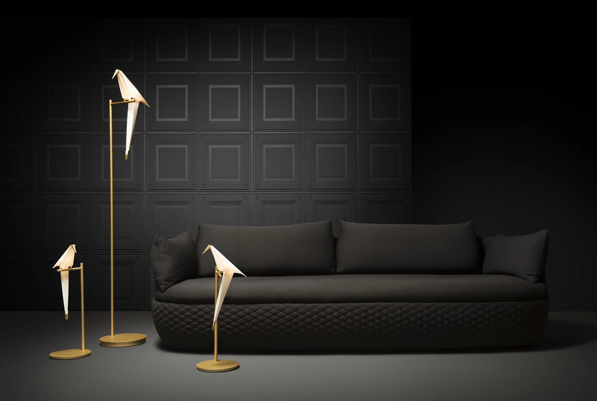 Bart Sofa with Perch floor lights against a dark wall