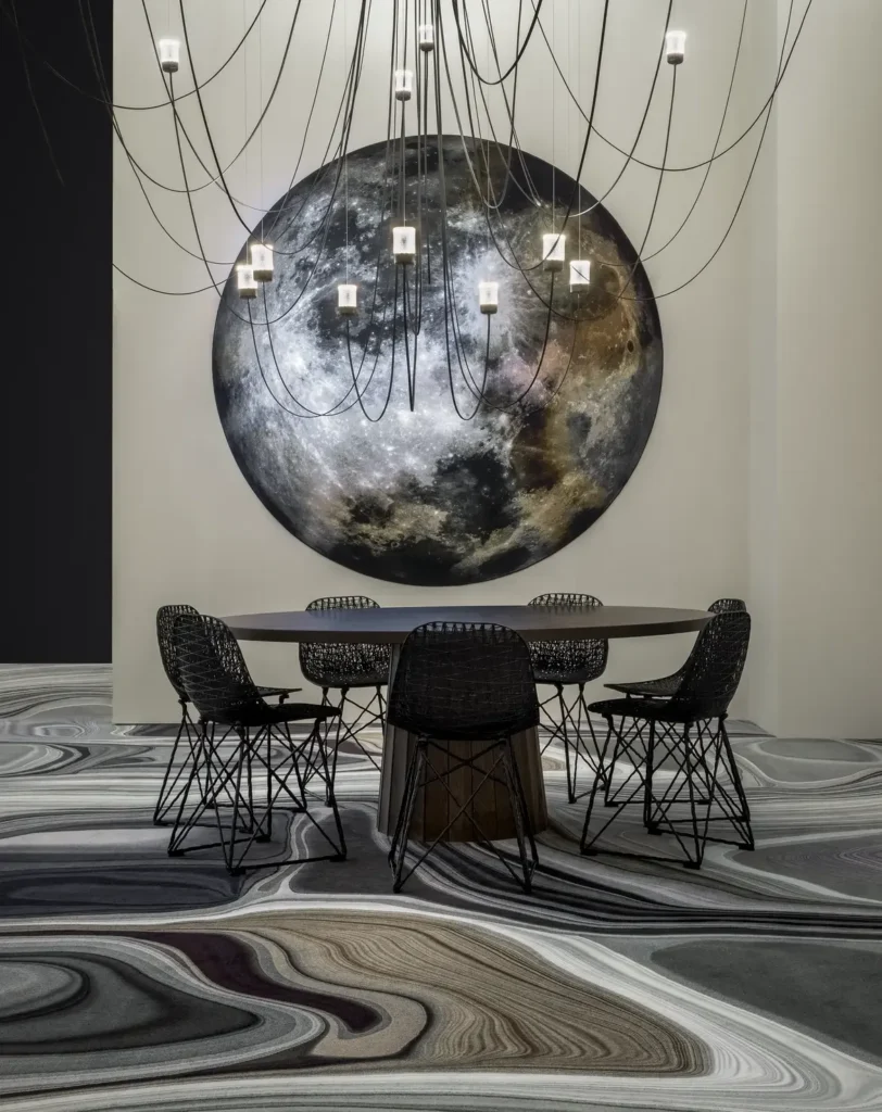 Carbon Chairs around a dining table at Moooi, Milan 2022