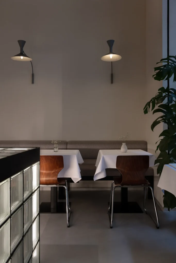 TT Central, Belgrade: tables along the banquette under swing-arm wall lights