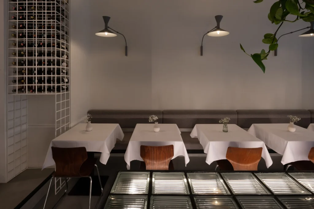 TT Central, Belgrade: banquette tables and the glass-block table