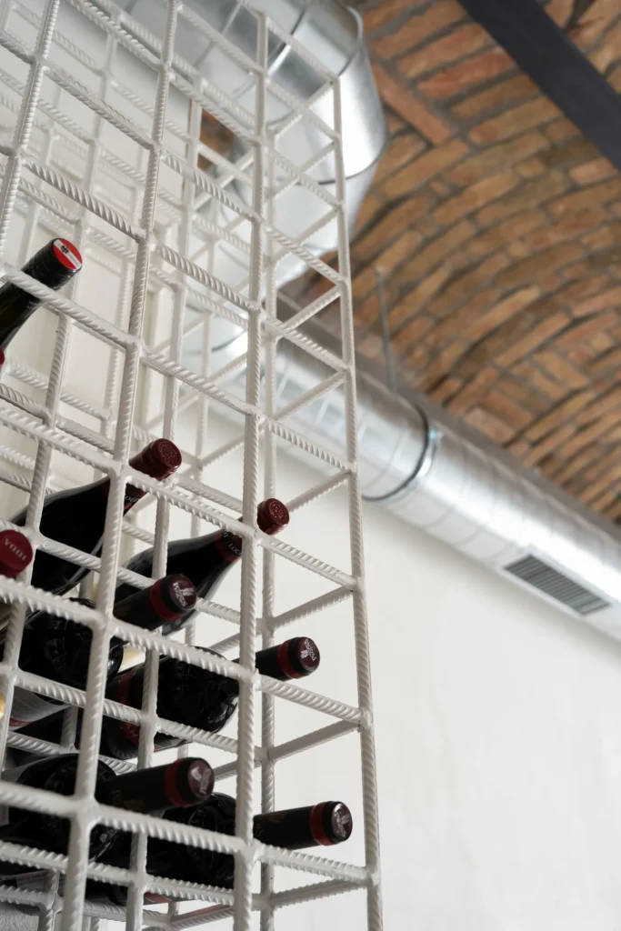 TT Central, Belgrade: white steel wine rack under the brick vault