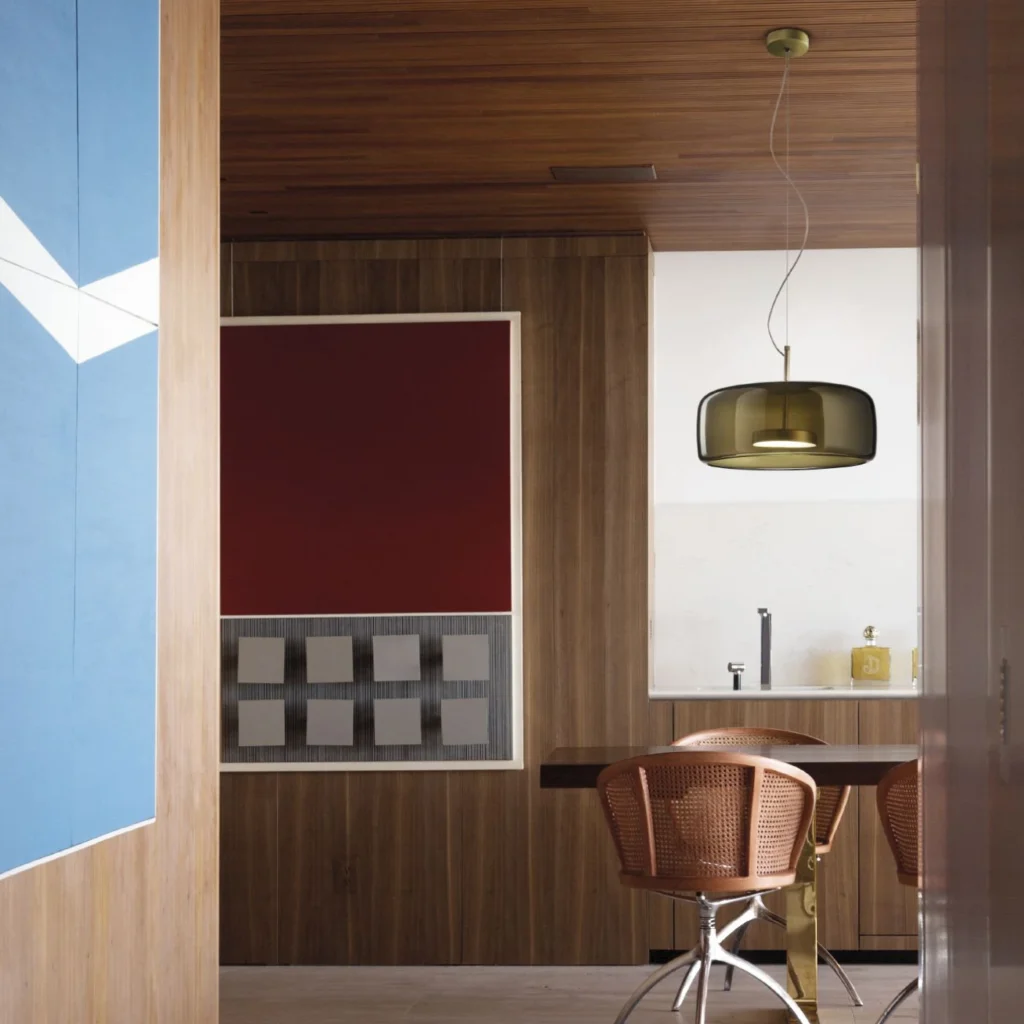 Vistosi Jube SP 1G pendant in smoky glass over a dining table in a walnut-panelled room